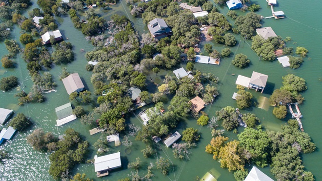 an aerial shot of homes destroyed by flooding